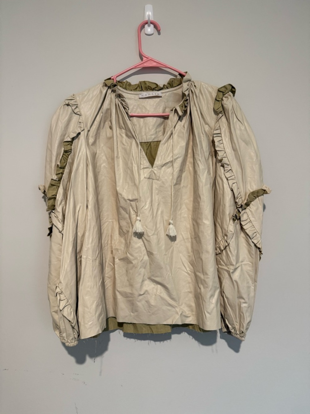 Karlie Feaux Leather Ruffled Tassel Drawstring Blouse in Cream & Olive